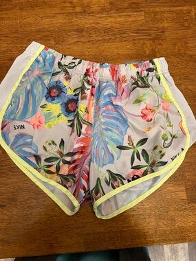 Nike women’s Dri-Fit Tropical Floral Athletic Shorts in White, Blue, Pink, Green